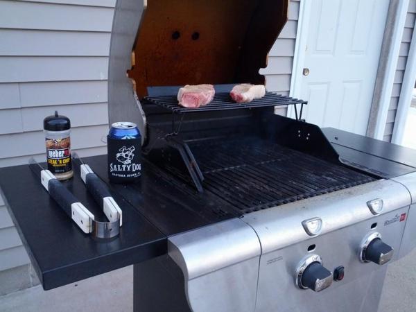 Photo of a grill with food cooking.