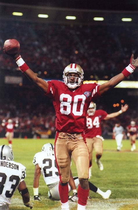 Photo of Jerry Rice scoring a touchdown.